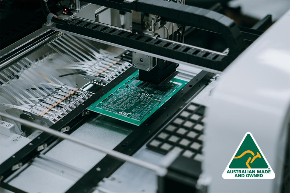 Automated manufacturing process with a green WiTi circuit board, featuring an 'Australian Made and Owned' logo.