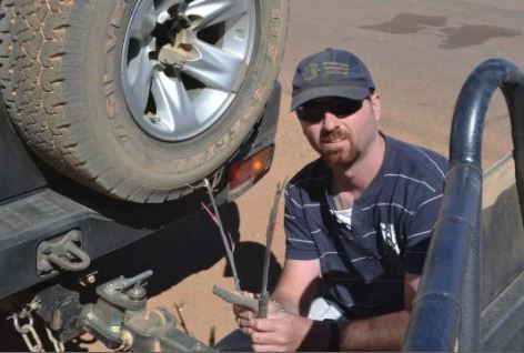 man with a broken trailer plug for his caravan