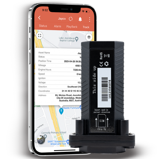 A black GPS tracking device with a smartphone showing a GPS map application, indicating real-time tracking capability.